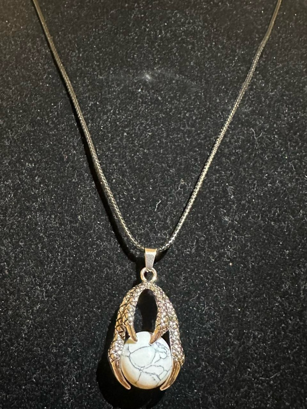 Silver dragon claw pendant necklace with Magnesite crystal ball.